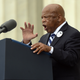 The late civil rights leader and Georgia congressman John Lewis delivers remarks in front of a freedom bell during the “Let Freedom Ring” commemoration event August 28, 2013, in Washington, DC. The event was to commemorate the 50th anniversary of Dr. Martin Luther King Jr.’s “I Have a Dream” speech and the March on Washington for Jobs and Freedom.